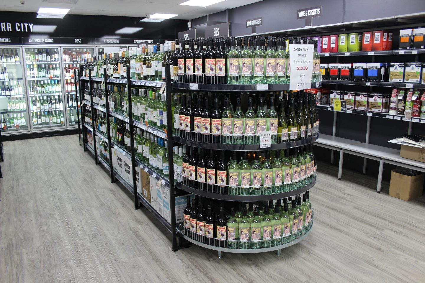 Radius end shelve liquor store shelving
